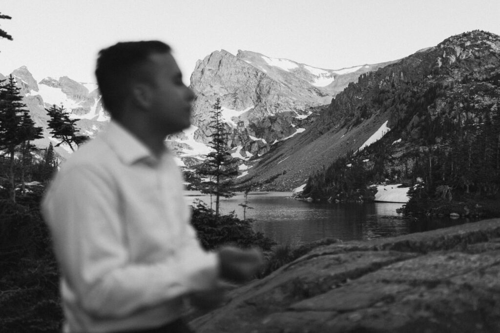 Groom getting ready for his wedding in the mountains