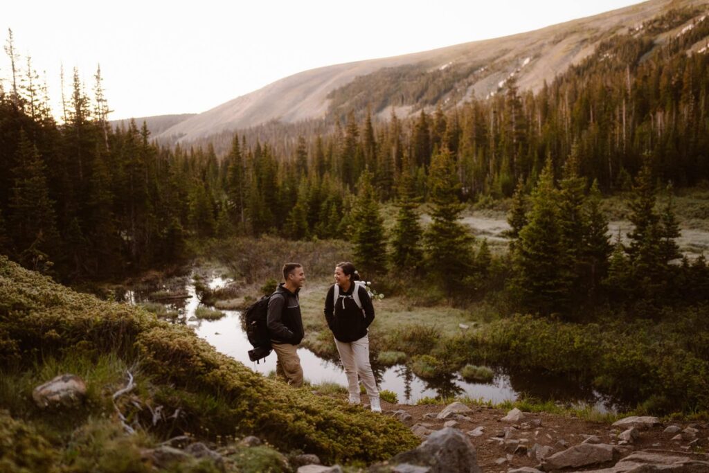 Couple on the hiking trail to Lake Isabelle on their wedding day