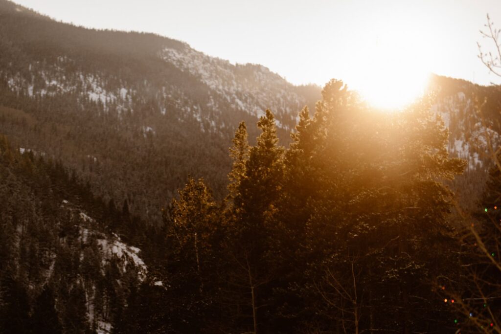 Sun dipping below the mountains