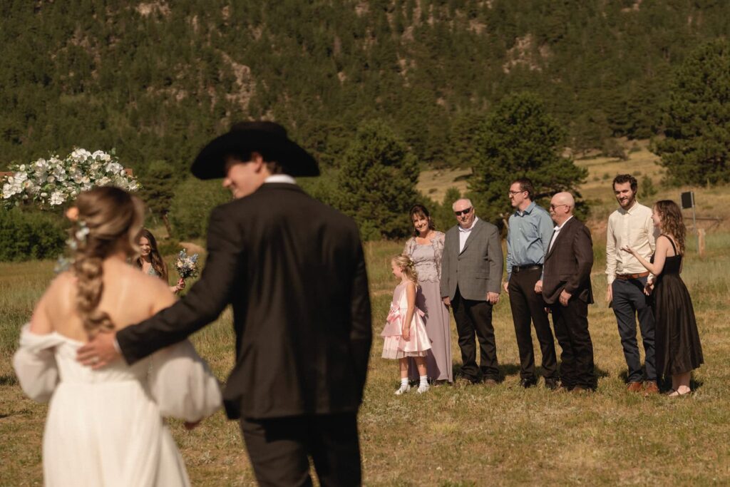 Happy guests witnessing wedding ceremony