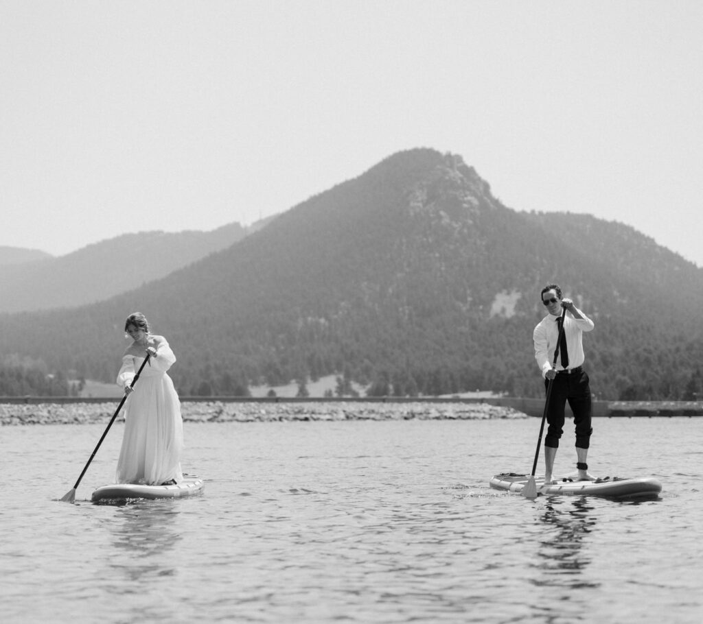 Bride and groom paddleboarding