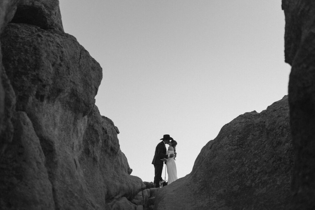 First kiss silhouette in the mountains