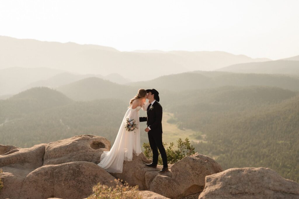 Couple sharing a kiss in the mountains