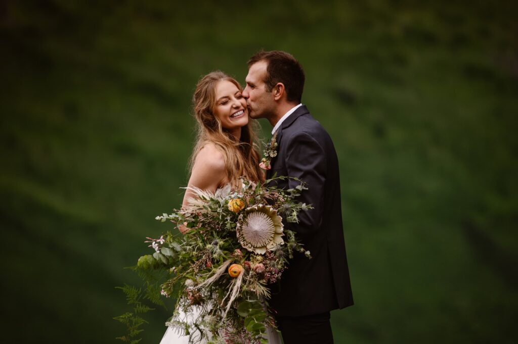 Stunning bridal bouquet with large flowers and greenery