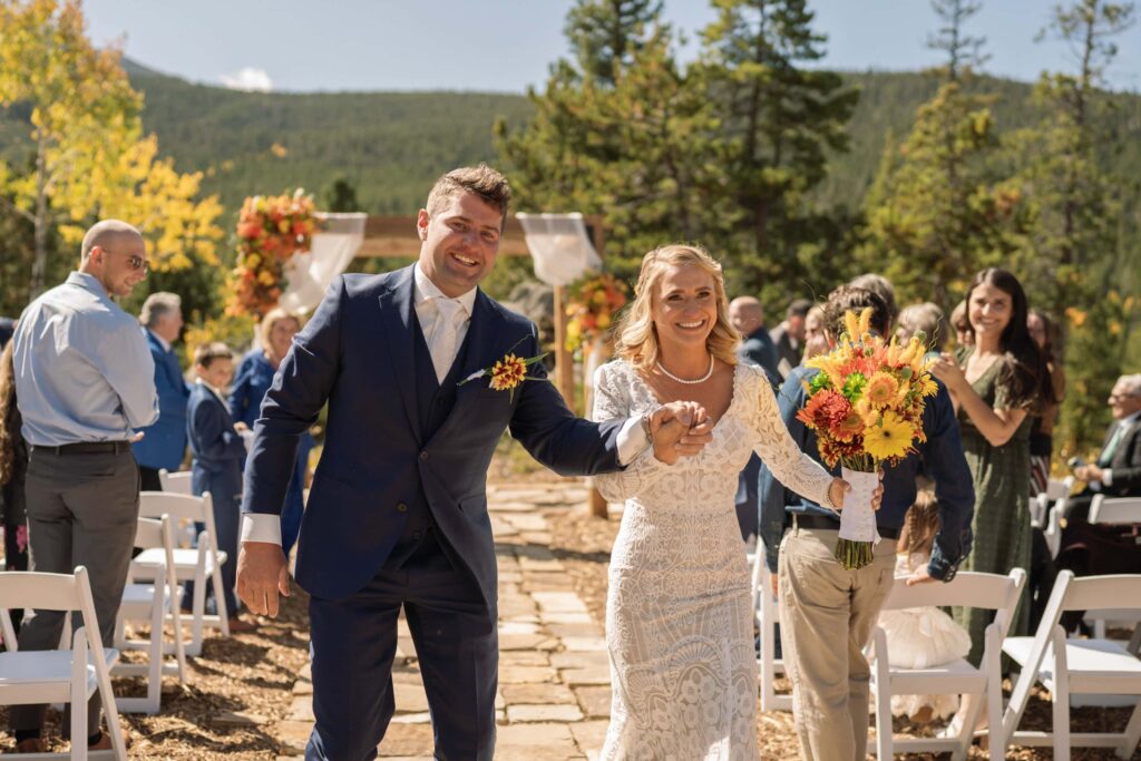 Bride and groom walking down aisle