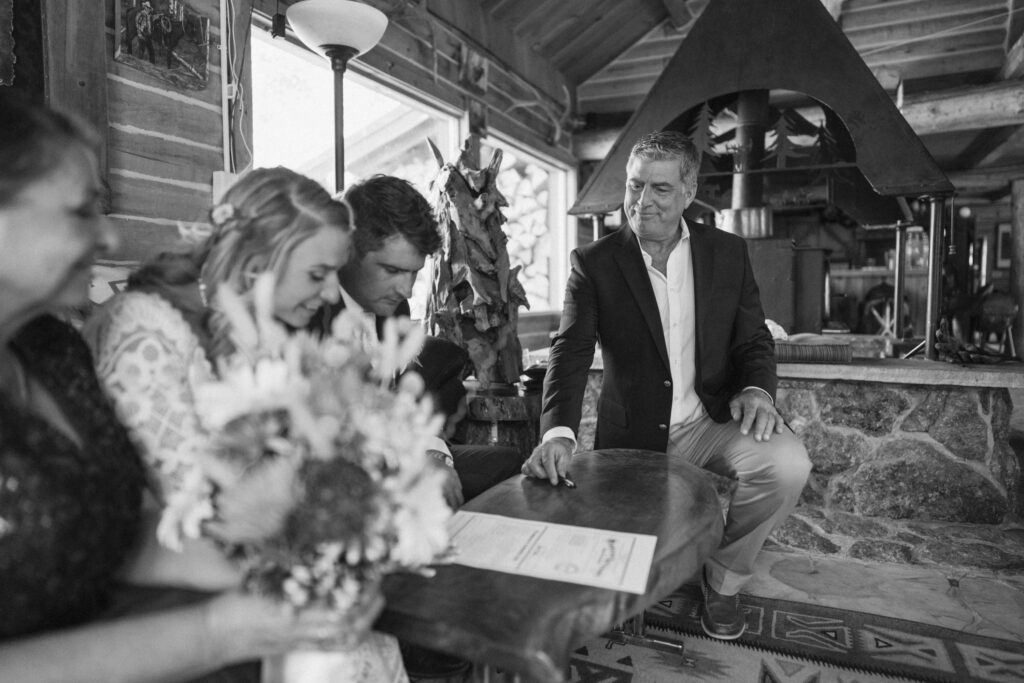 Marriage license signing inside Estes Park cabin