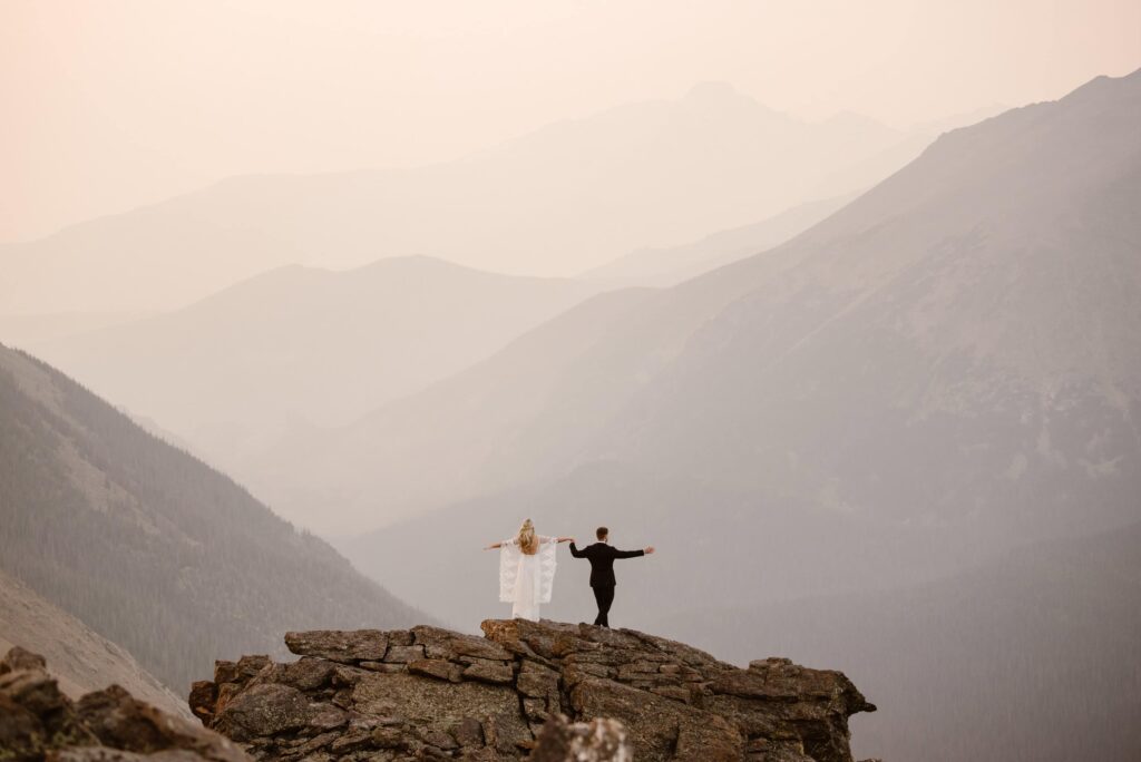 Bride and groom on a mountaintop