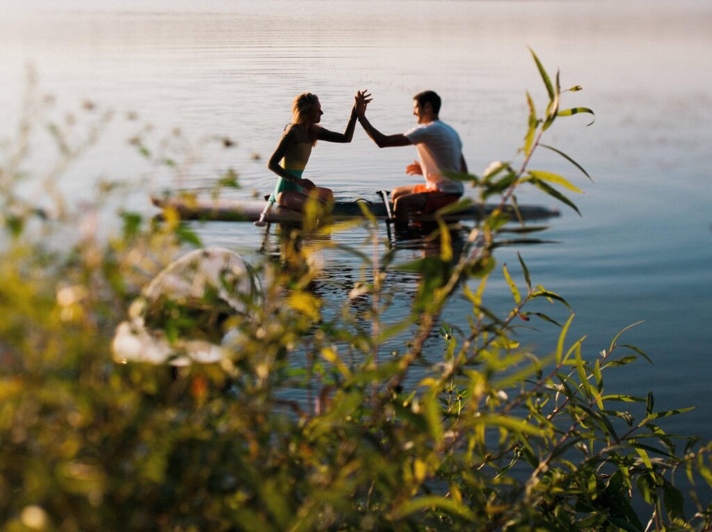 Estes Park couples photoshoot on a stand up paddle board