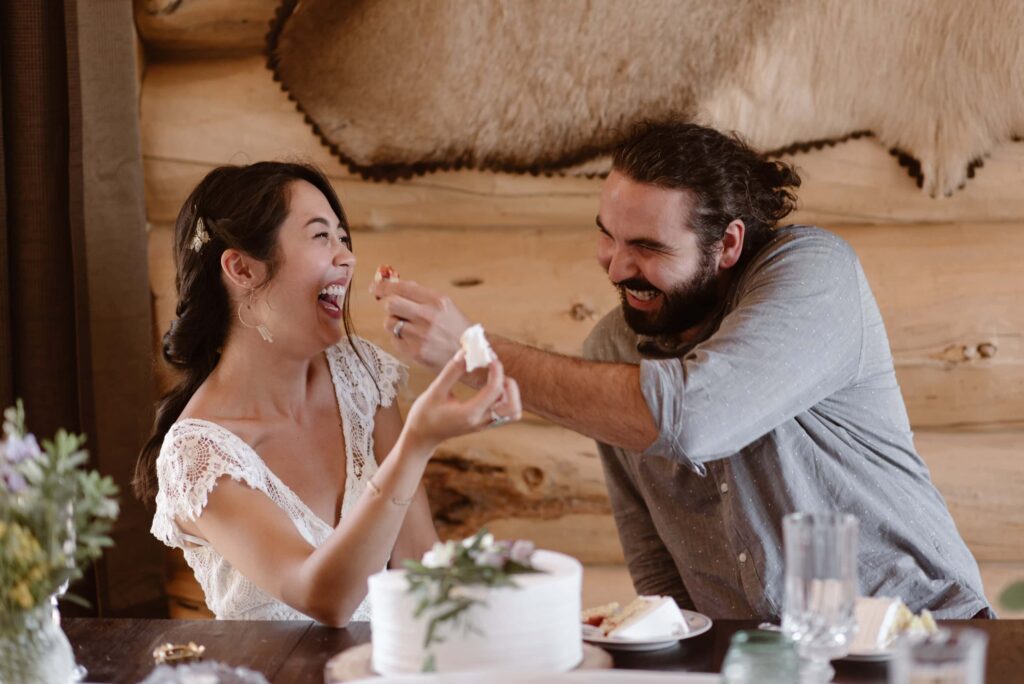 Bride and groom eating cake