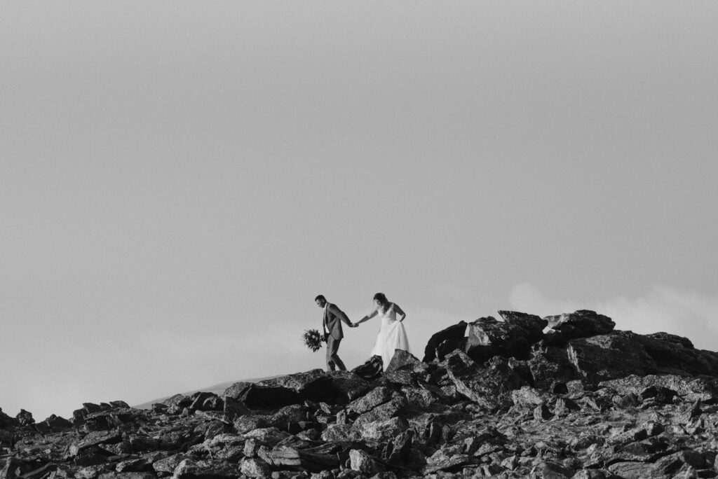 Couple on a mountaintop during their elopement