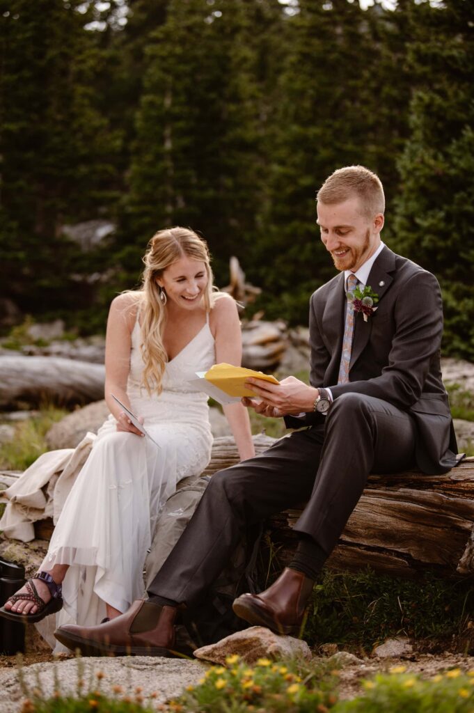 Couple reading letters from family during elopement