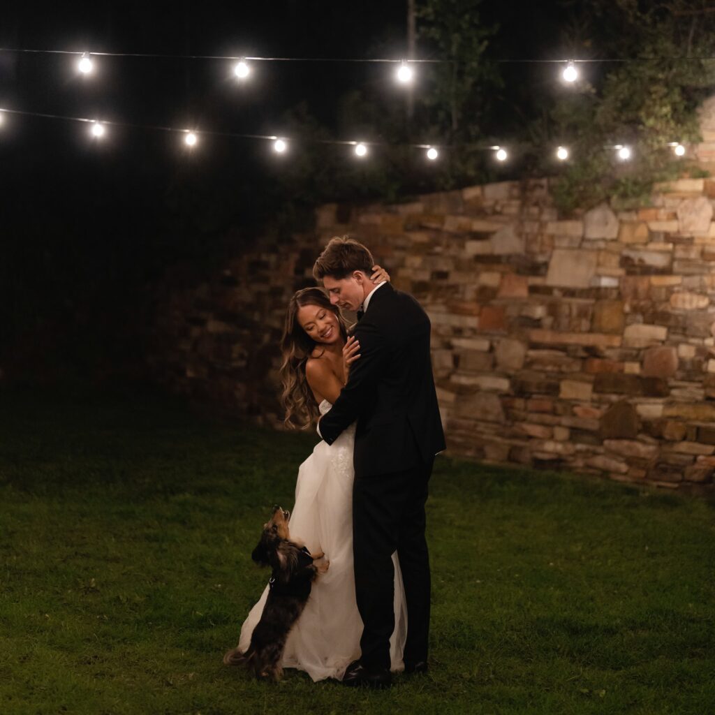 Wedding first dance with dog under the market lights