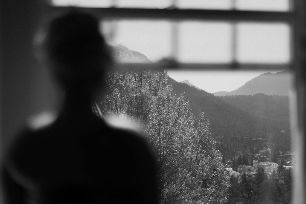 Bride looking out of window