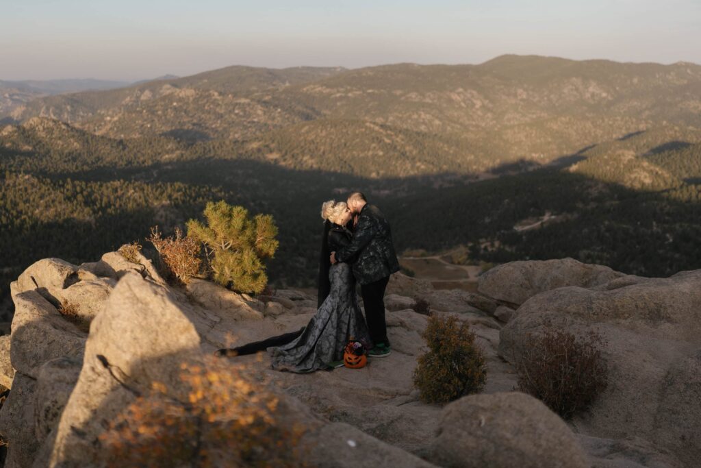 Bride and groom share first kiss on mountaintop