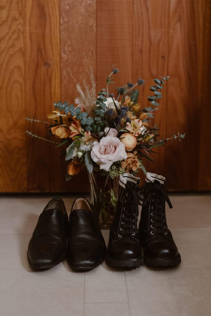Black Dr. Marten wedding shoes with bouquet