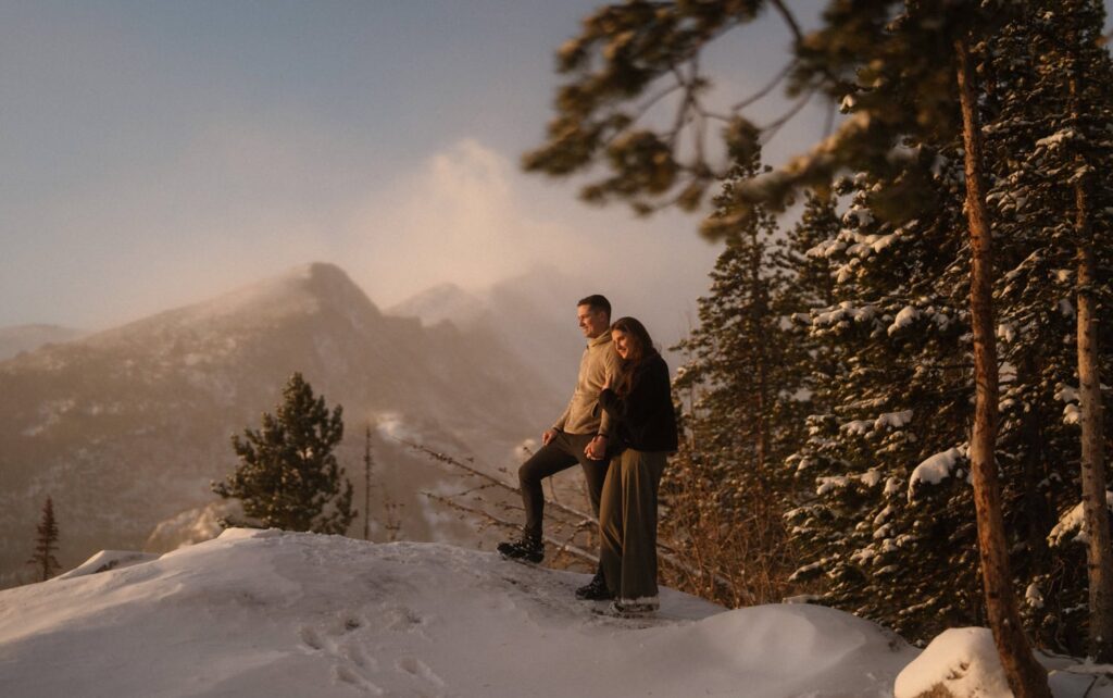 Couple in the snowy mountains of Estes Park