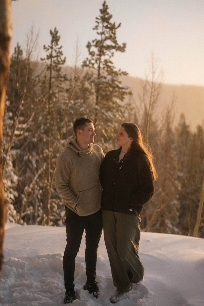Snowy engagement photos of couple in the mountains