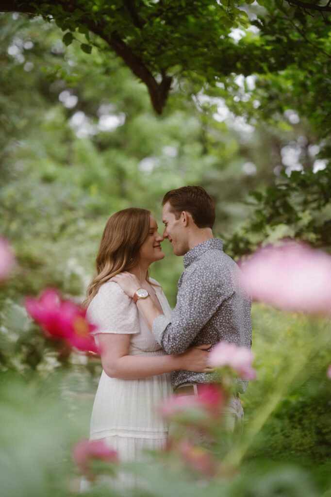Romantic and soft engagement photos in a floral garden