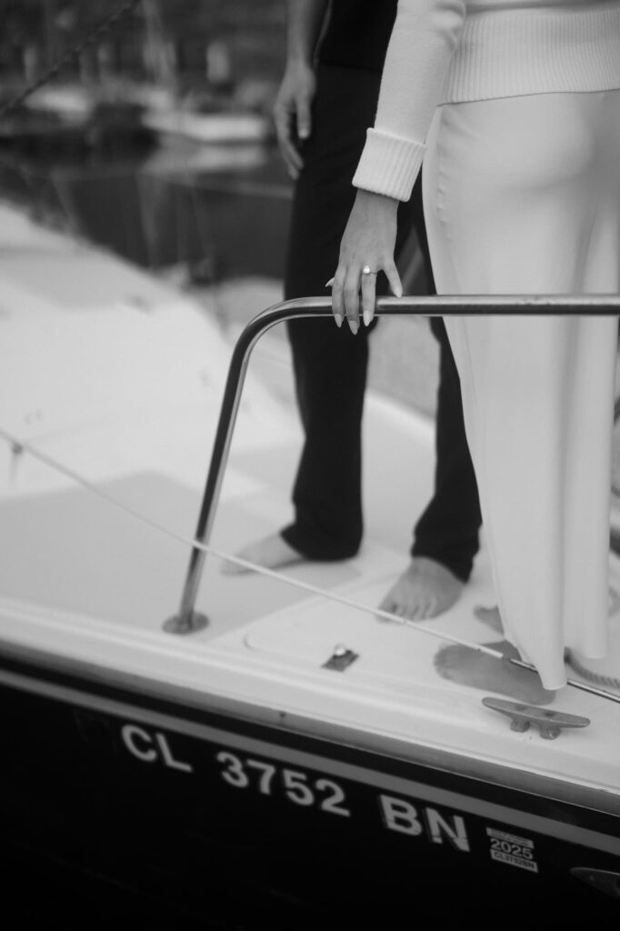 Engagement ring on the edge of the sailboat