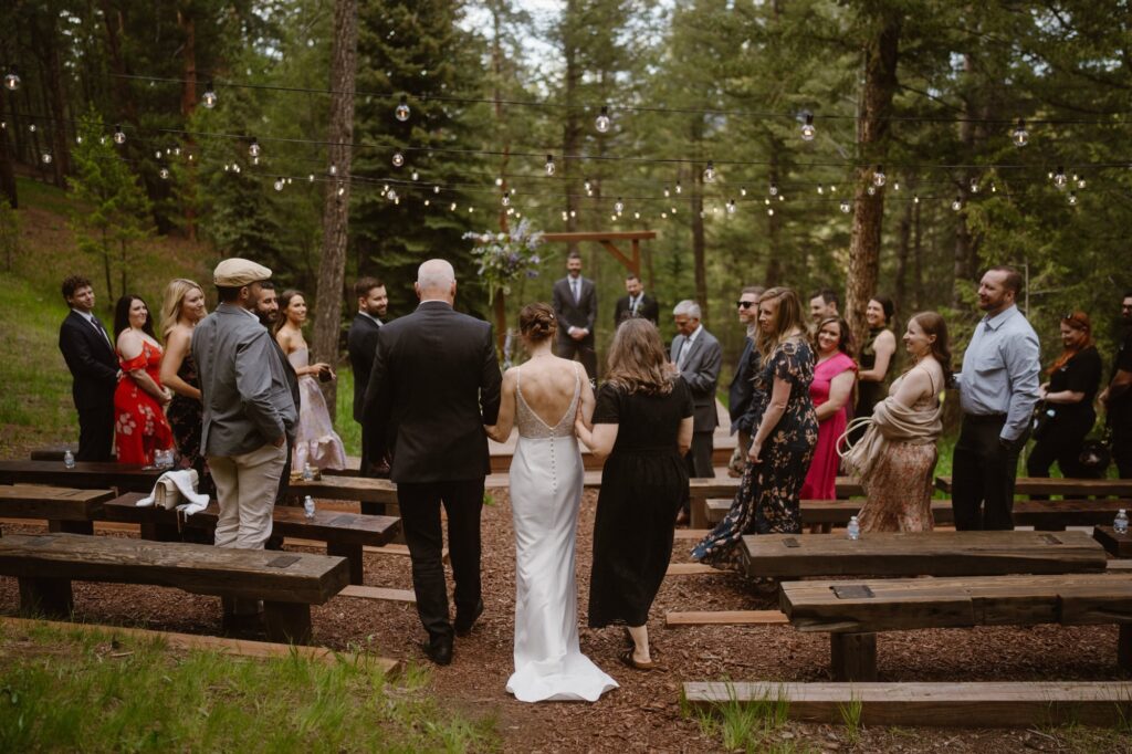Walking down the aisle during outdoor wedding ceremony
