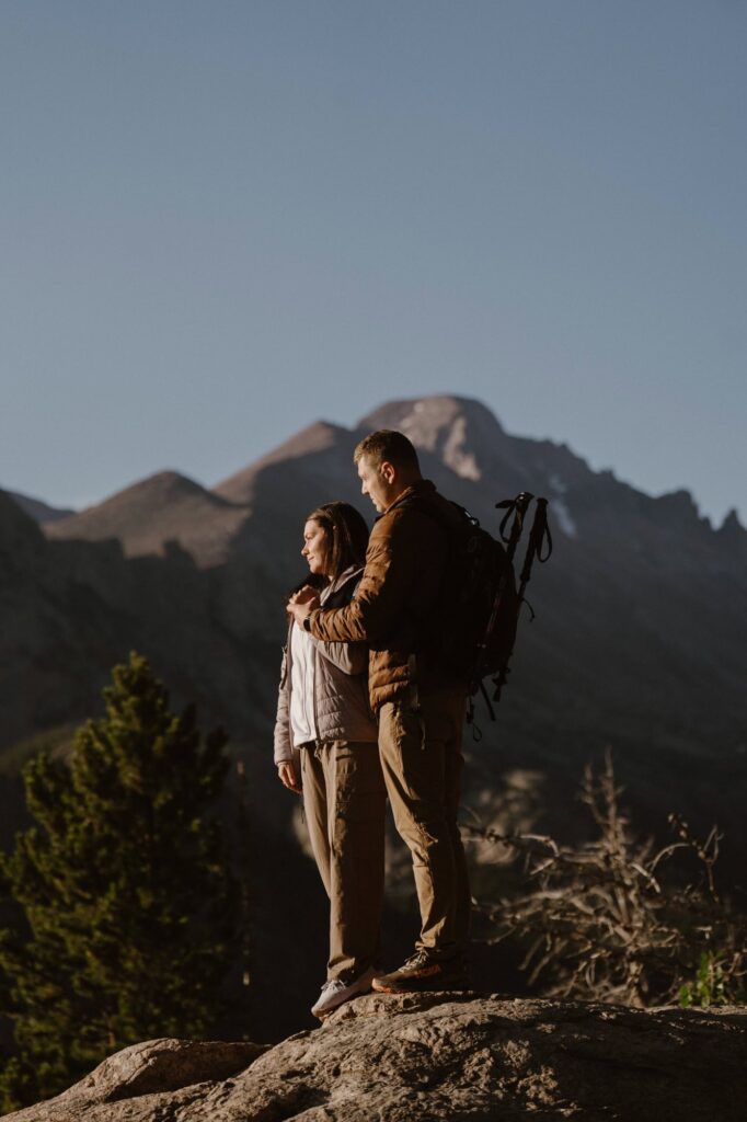 Couple on a rocky overlook with mountain views