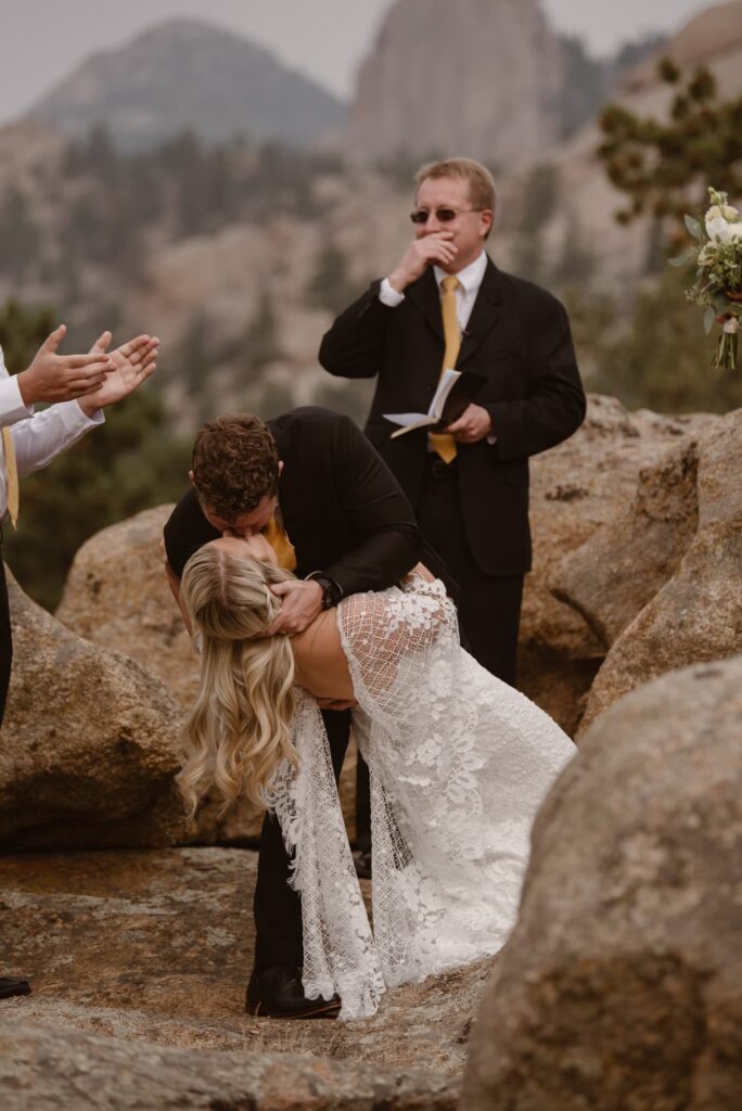 First kiss with a dip during wedding ceremony at Aspen Falls