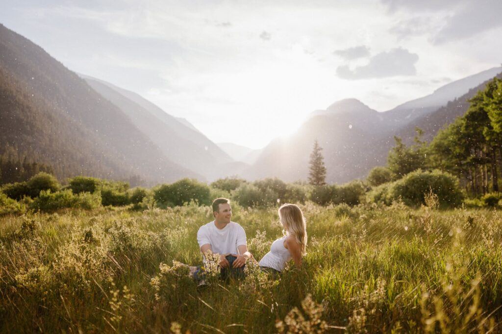 Mountain maternity photos in Colorado meadow near Estes Park