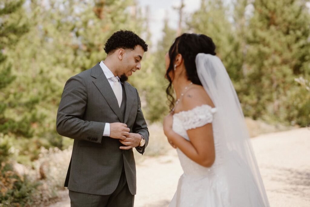 Groom in awe of bride during first look