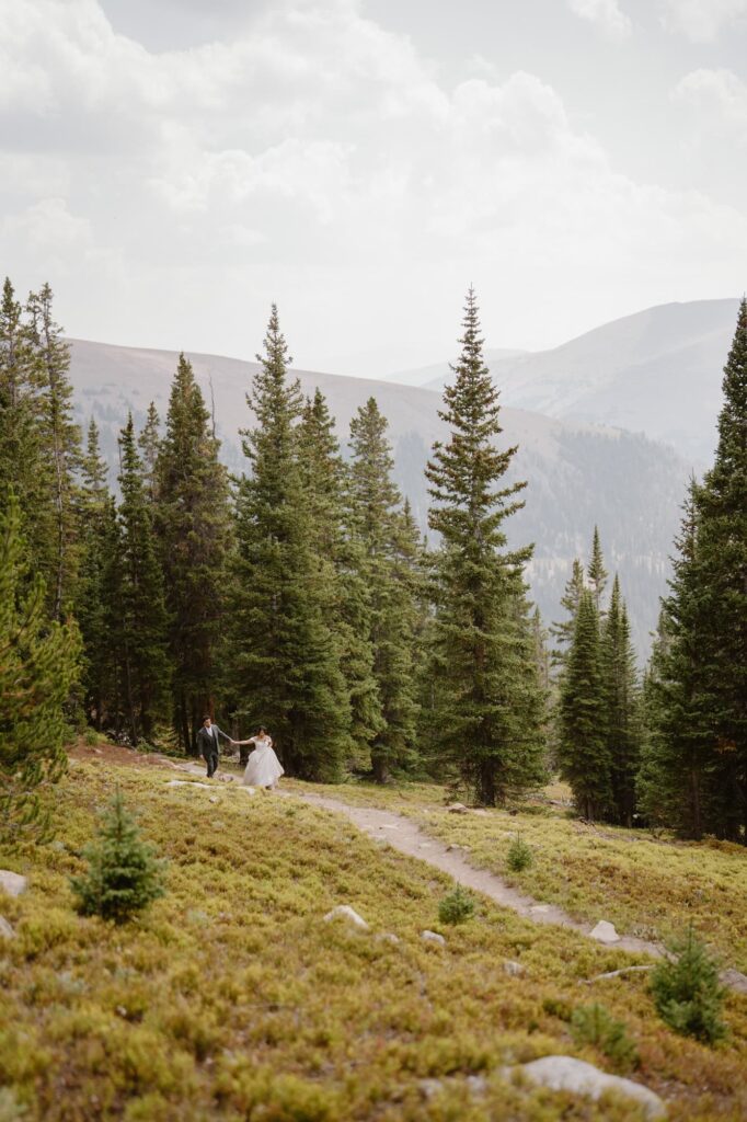 Bride and groom hiking in Colorado