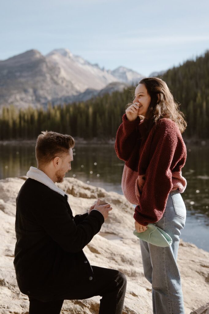 Surprise engagement at Bear Lake in Rocky Mountain National Park