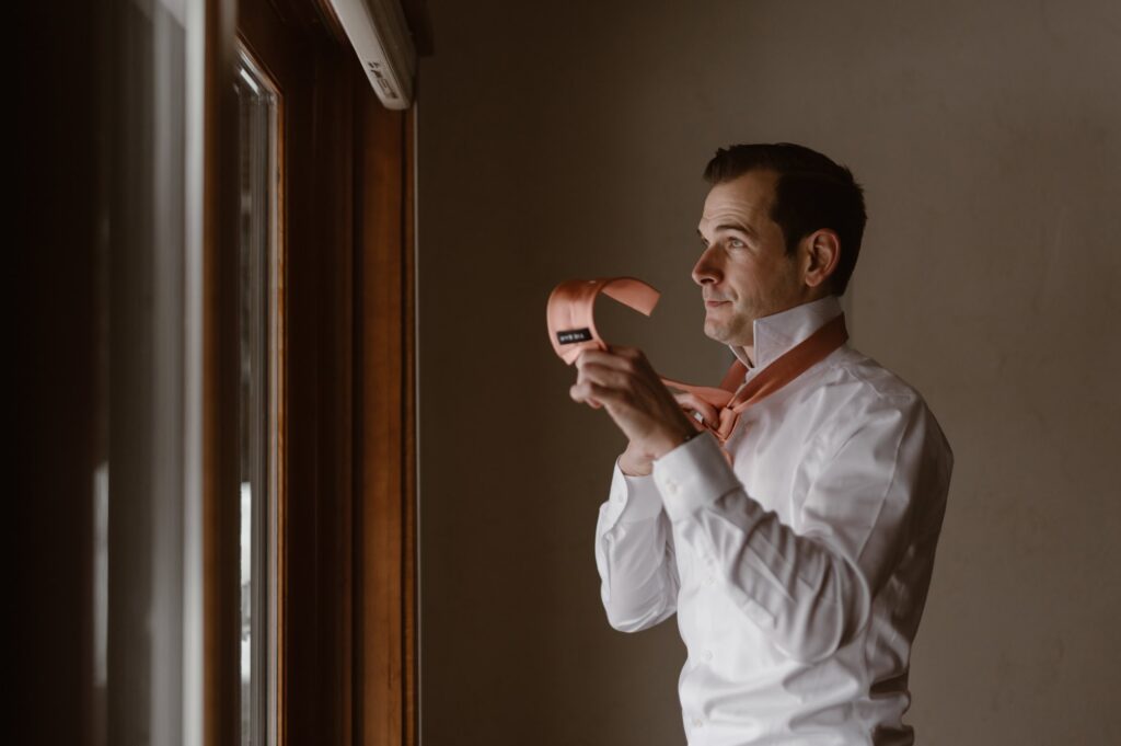 Groom getting ready for winter wedding