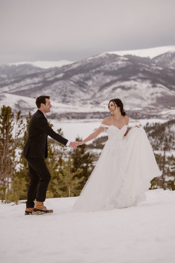 Bride and groom in the snow at Sapphire Point Overlook