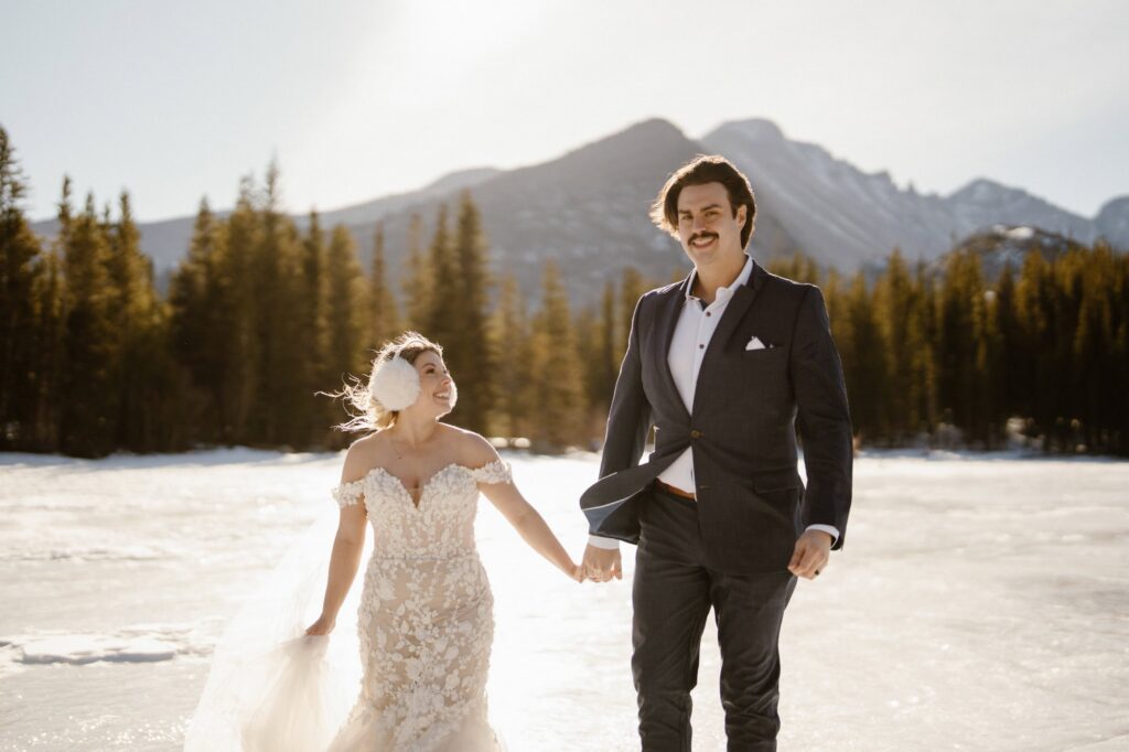 Bride and groom at Bear Lake with Longs Peak in the background