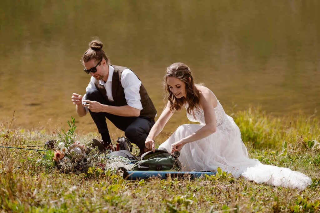 Bride and groom fly fishing at their Colorado wedding