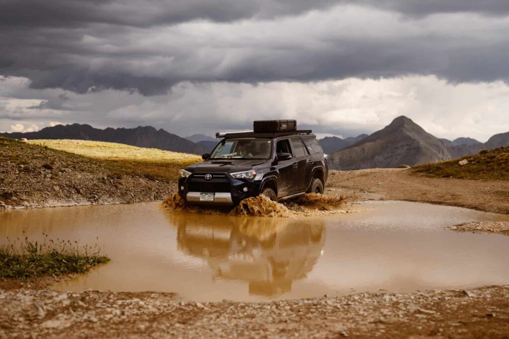 Wedding off-roading photos in Colorado mountains during