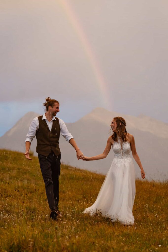 Sunset rainbow wedding photos in Colorado mountains
