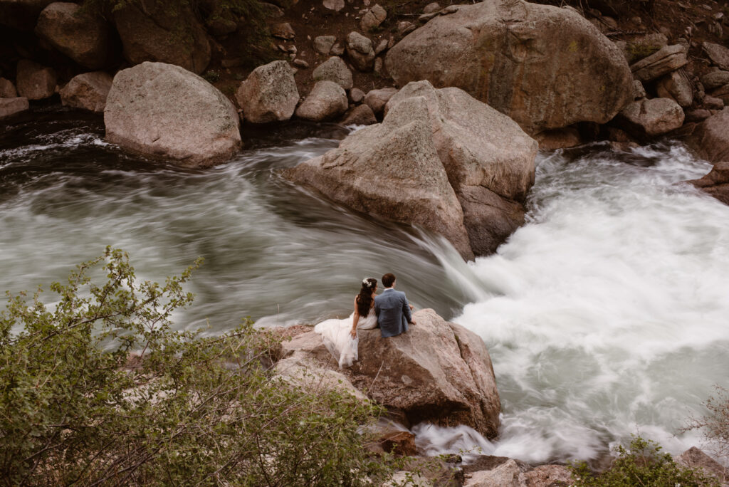 Bride and groom portraits at waterfall during Colorado elopement