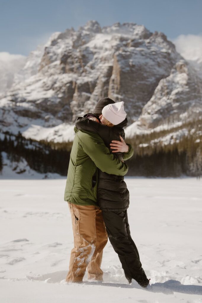Estes Park proposal at a frozen mountain lake