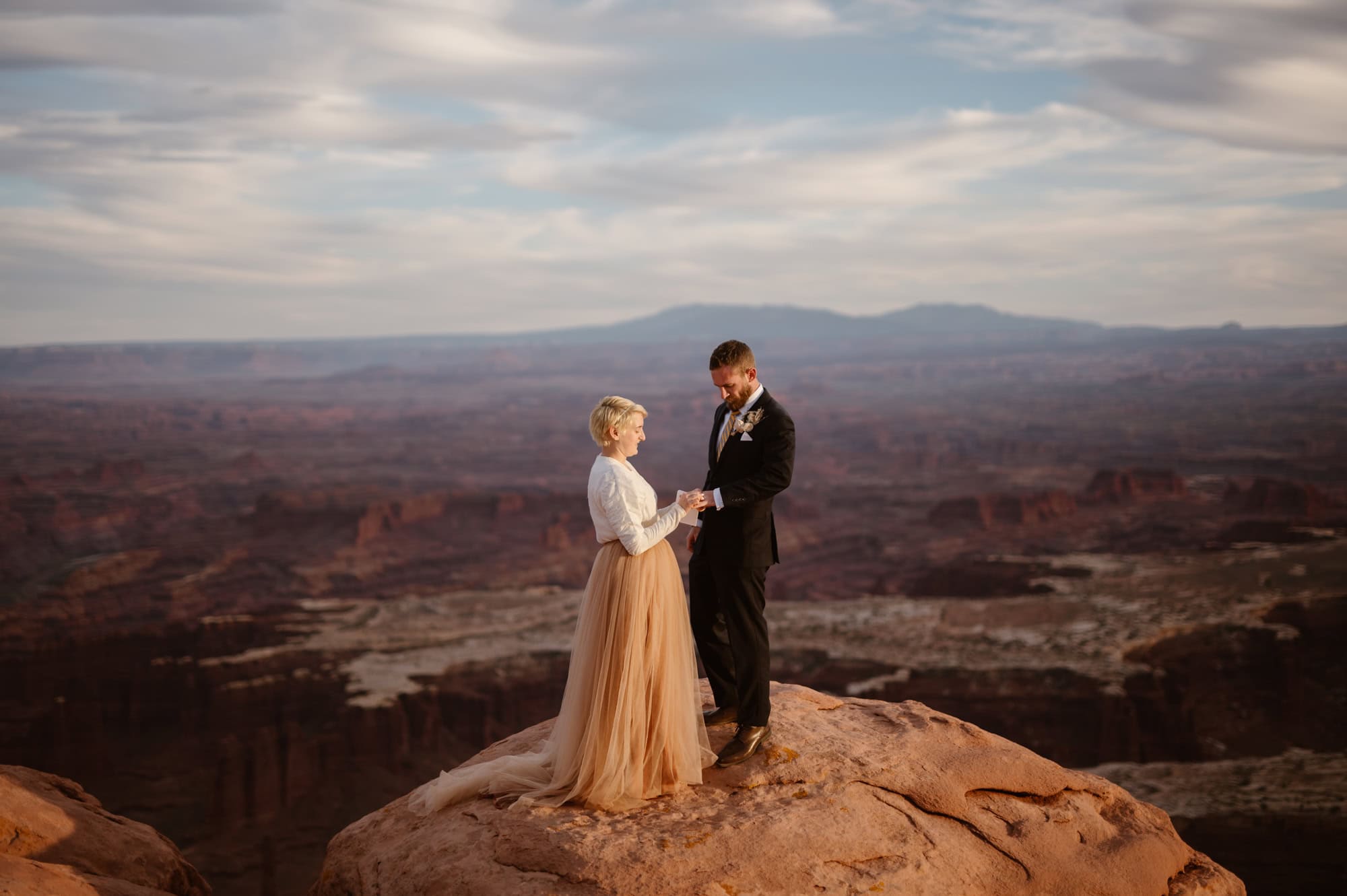 Elopement ceremony at sunset on cliff edge