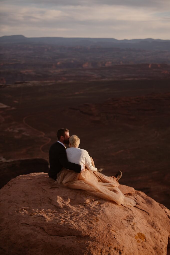 Sunset elopement photos at Grand View Point in Canyonlands