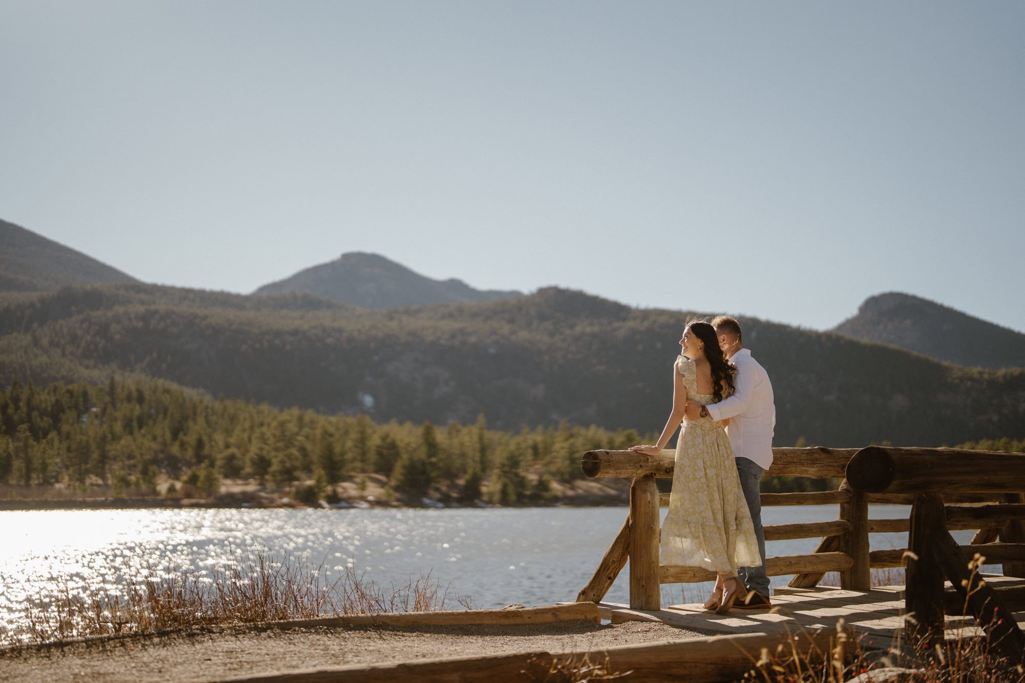 Romantic lakeside engagement photography at Lily Lake in Estes Park