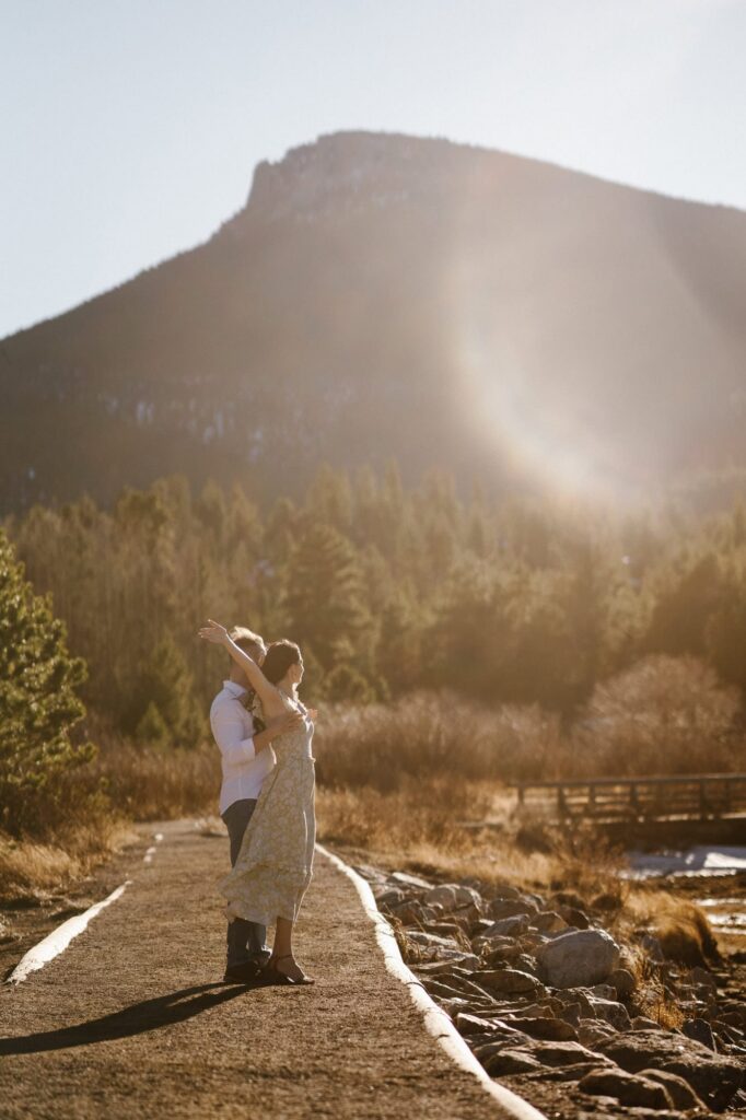 Film engagement photos at Lily Lake in Estes Park at sunset