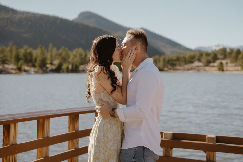 Couple shares first kiss after surprise engagement at Lily Lake dock
