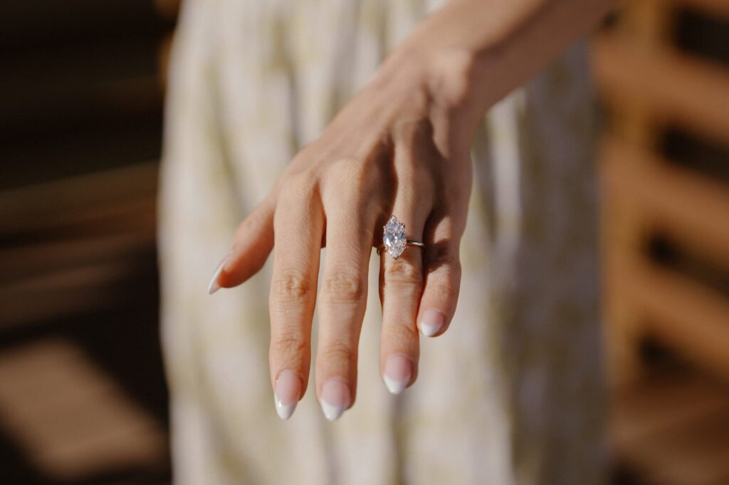 Close up of sparkly engagement ring after surprise proposal
