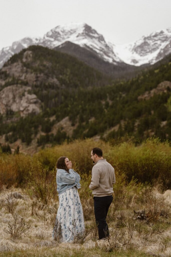 Surprise proposal in a mountain meadow in RMNP