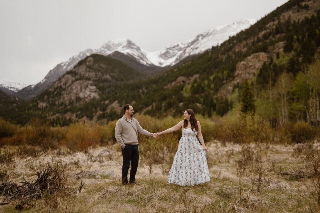 Proposal photos in a mountain meadow in Rocky Mountain National Park