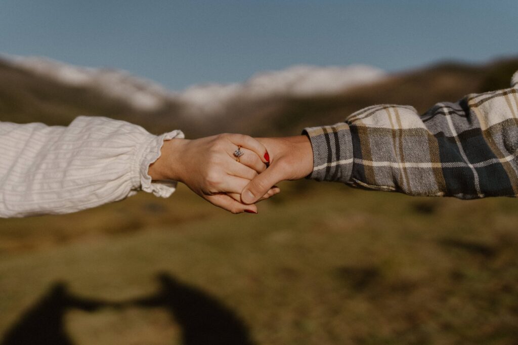 Engagement ring with mountains in the background