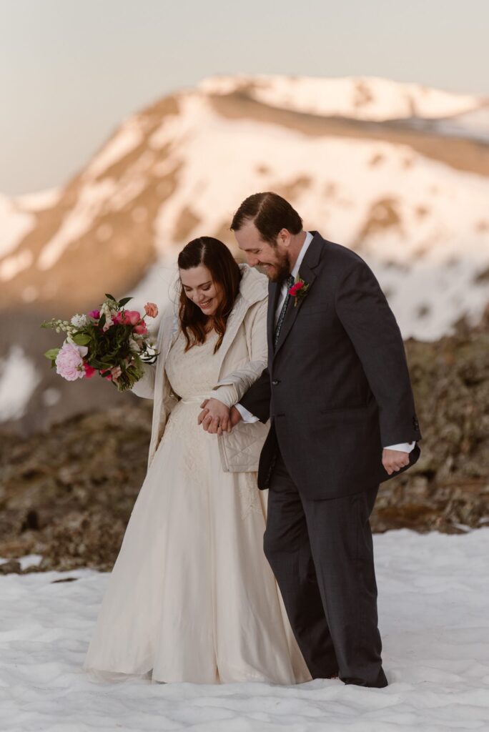 Candid photos of bride and groom in the mountains on their elopement day