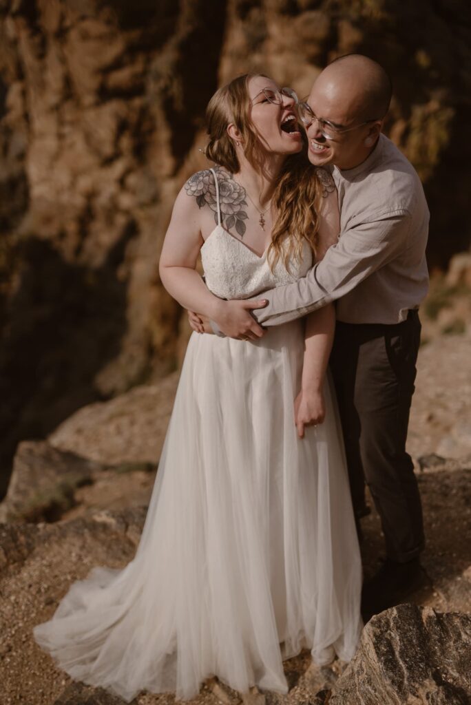 Wedding portrait of bride and groom on a mountain