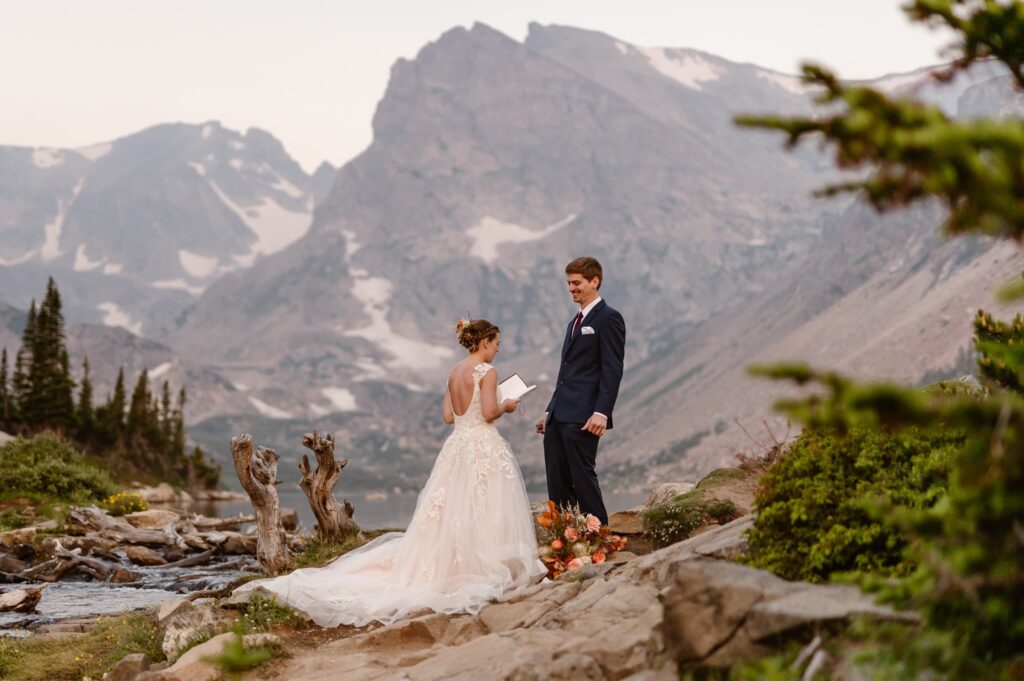 Couple getting married at Lake Isabelle after a sunrise hike